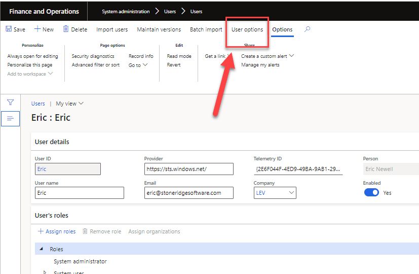 Finance and Operations screen is shown (system administration > users > users). An arrow is pointing to "User options", which is circled in red.